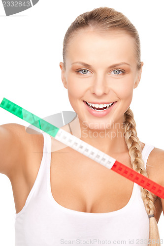 Image of young beautiful woman with measure tape