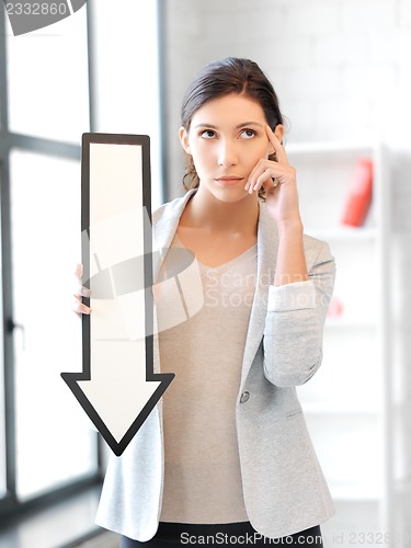 Image of businesswoman with direction arrow sign