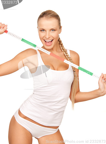 Image of young beautiful woman with measure tape