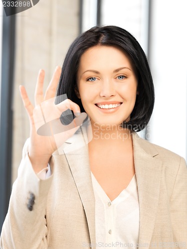 Image of young woman showing ok sign