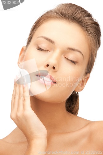 Image of beautiful woman with cotton pad