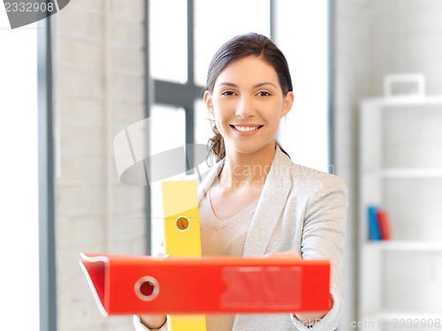 Image of beautiful woman with folder