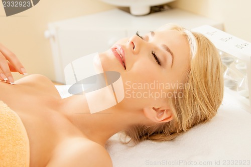 Image of beautiful woman in spa salon