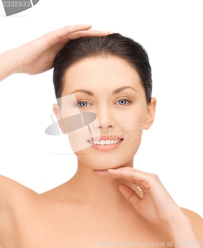Image of face and hands of beautiful woman