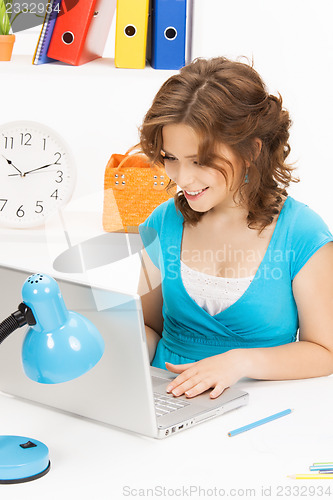 Image of happy woman with laptop computer