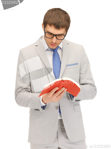 Image of calm and serious man with book