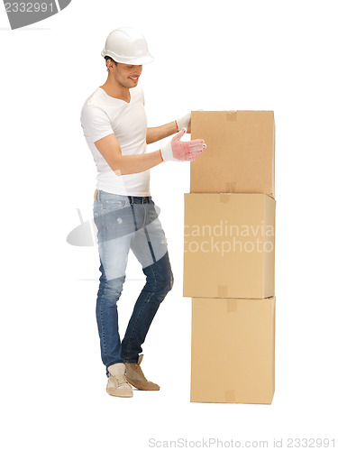 Image of handsome man with big boxes