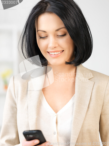 Image of businesswoman with cell phone