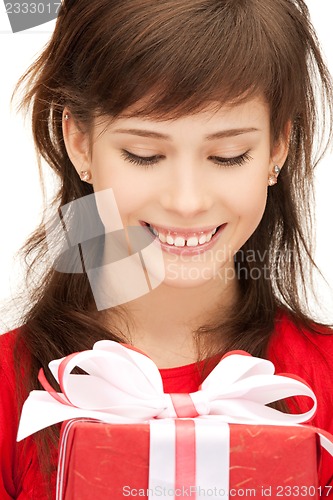Image of happy teenage girl with gift box