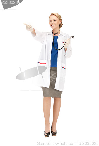 Image of attractive female doctor pointing her finger
