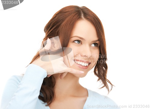 Image of woman making a call me gesture