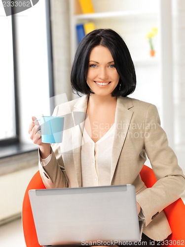 Image of happy woman with laptop computer