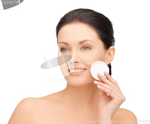 Image of beautiful woman with cotton pad