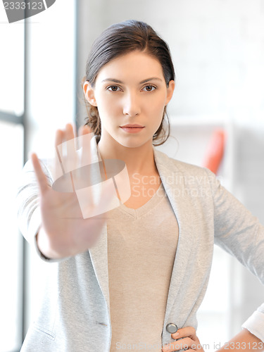 Image of woman making stop gesture