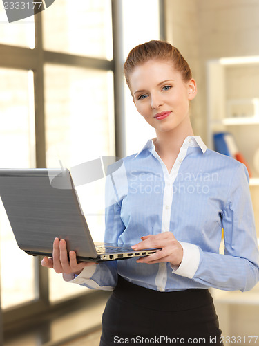 Image of happy woman with laptop computer