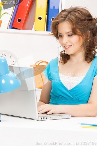 Image of happy woman with laptop computer