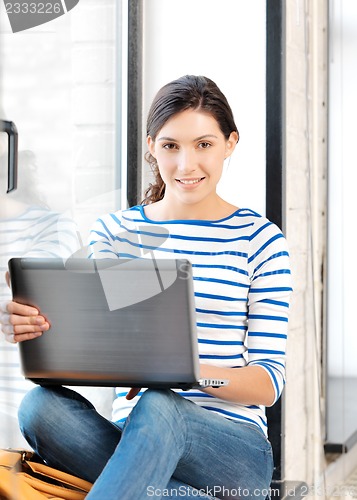 Image of happy teenage girl with laptop computer