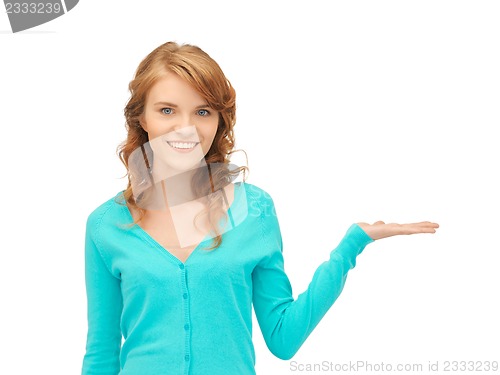 Image of girl showing something on the palm of her hand