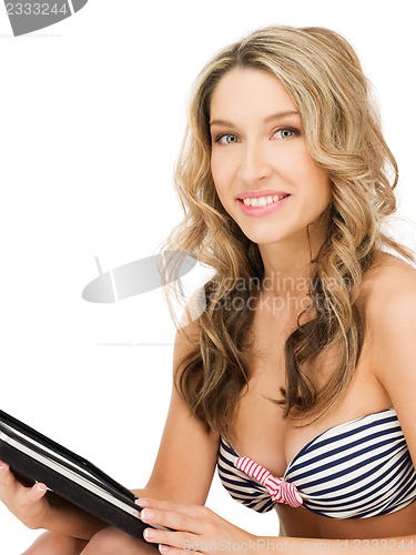 Image of woman in bikini with tablet pc computer