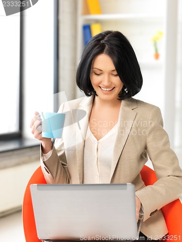 Image of happy woman with laptop computer