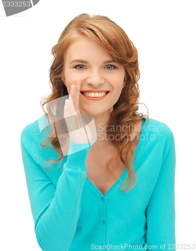 Image of teenage girl whispering gossip