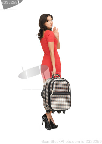 Image of unhappy woman with suitcase waving hand