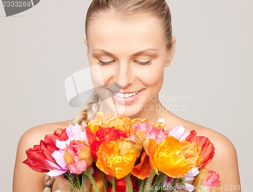 Image of lovely woman with red flowers