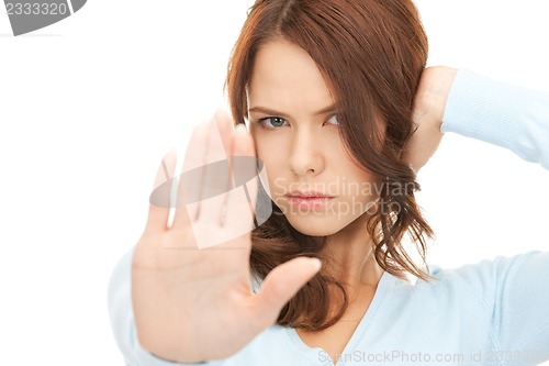 Image of woman making stop gesture