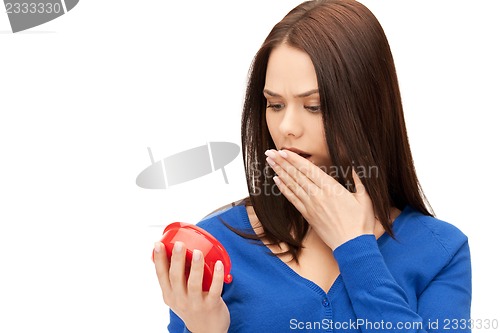 Image of woman holding alarm clock