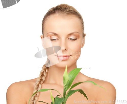 Image of woman with green sprout