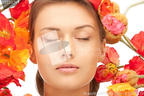 Image of lovely woman with red flowers