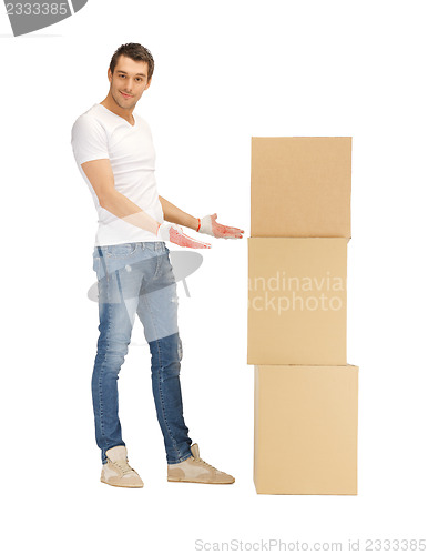 Image of handsome man with big boxes