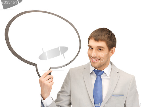 Image of smiling businessman with blank text bubble