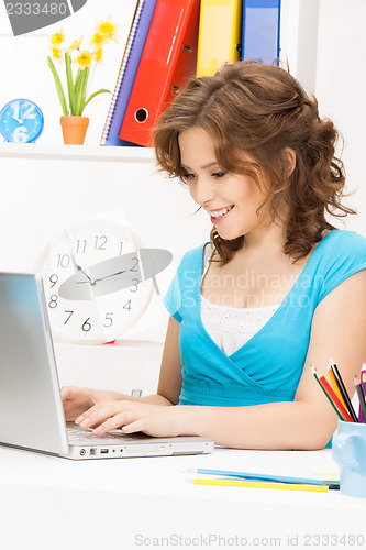 Image of happy woman with laptop computer
