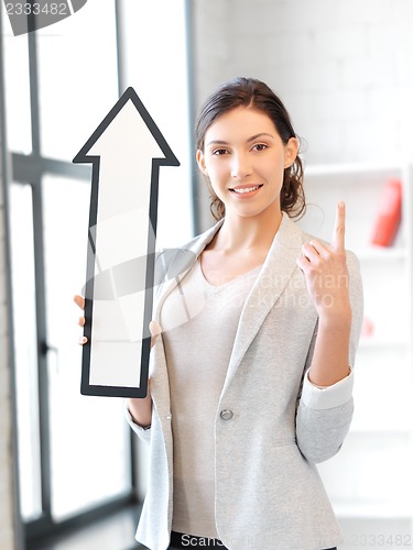 Image of businesswoman with direction arrow sign