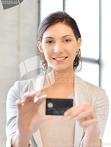 Image of happy woman with credit card