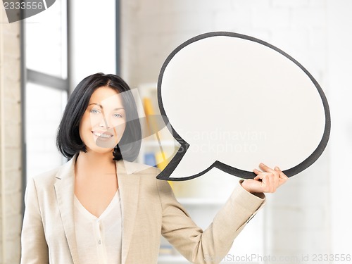 Image of smiling businesswoman with blank text bubble