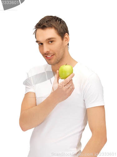 Image of man in white shirt with green apple