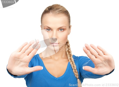 Image of woman making stop gesture