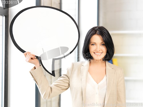 Image of smiling businesswoman with blank text bubble