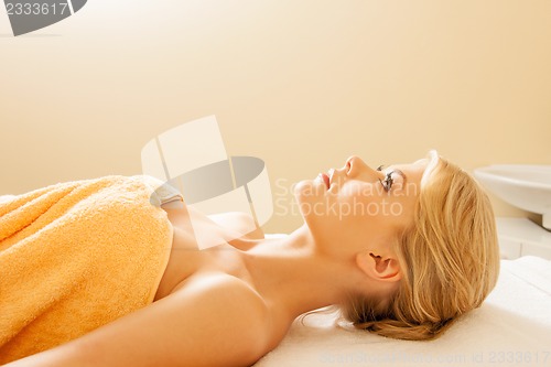 Image of beautiful woman in spa salon