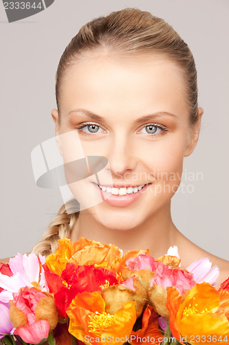 Image of lovely woman with red flowers