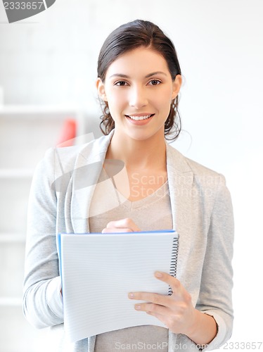 Image of happy woman with big notepad