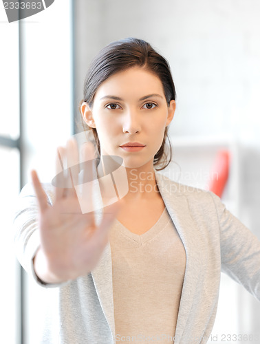 Image of woman making stop gesture