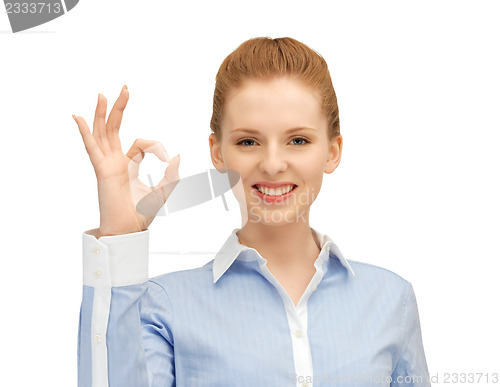Image of young woman showing ok sign