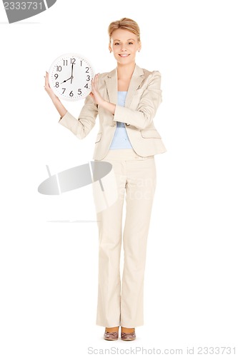 Image of woman holding big clock