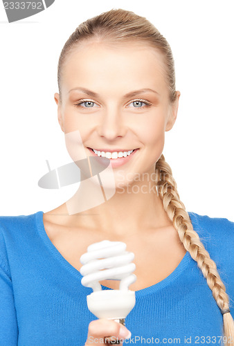 Image of woman holding energy saving bulb