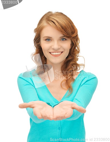 Image of girl showing something on the palms of her hands