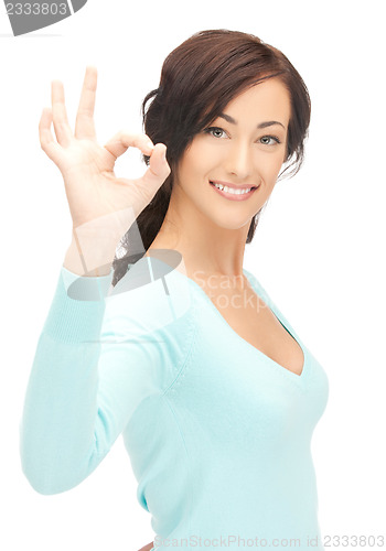 Image of young woman showing ok sign