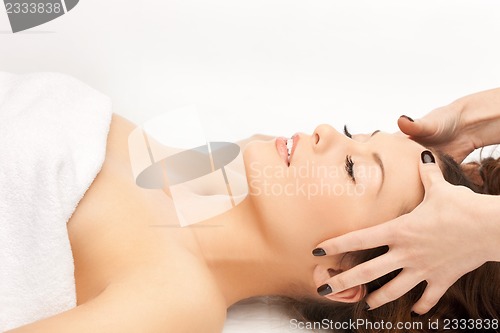 Image of beautiful woman in massage salon